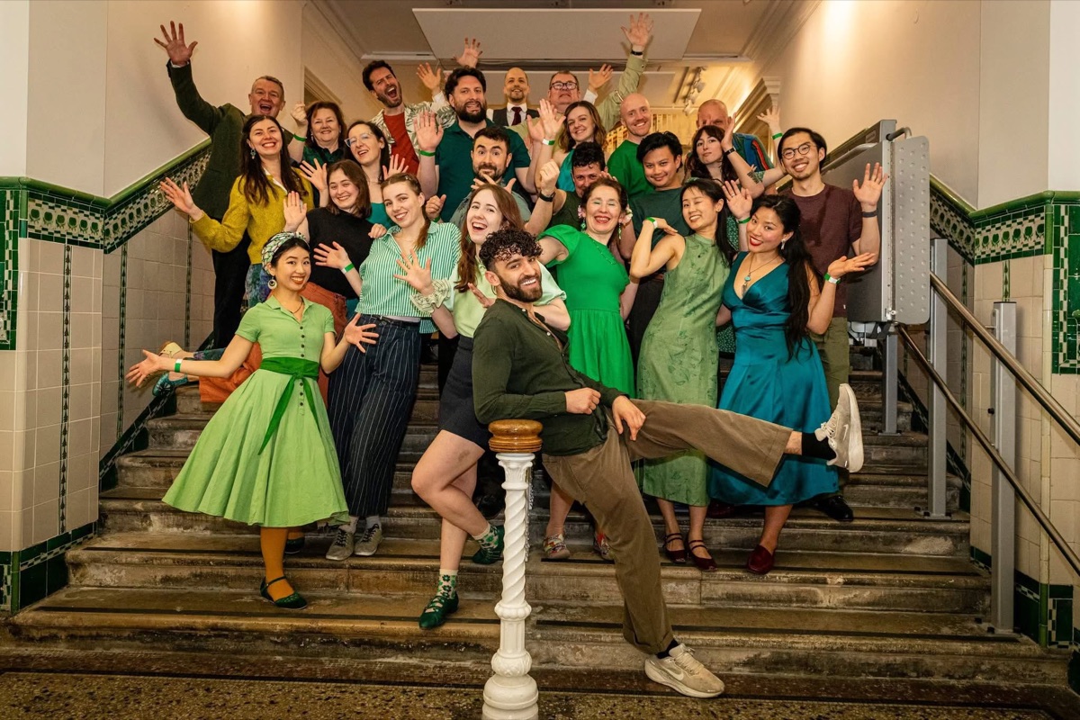 Dancers from the Monday Lindy Hop and swing class in London posing together on a tiled staircase